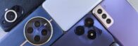 Top view of various modern smartphones showcasing diverse camera designs on flat surface.